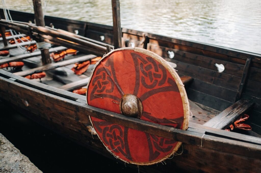 an antique viking ship on the river. old boat